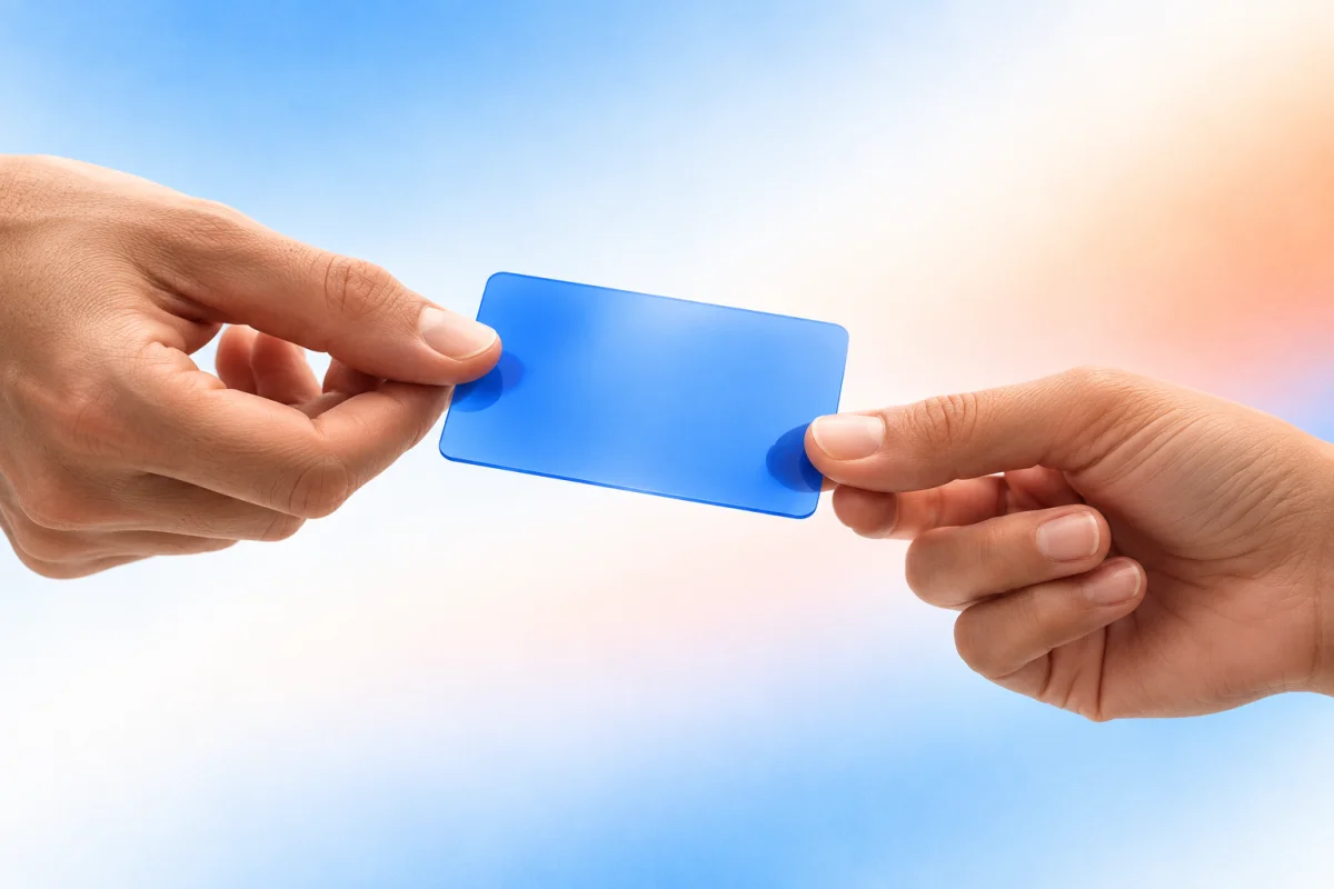 Two hands pass a translucent blue card, illustrating a lead handoff between connected teams.